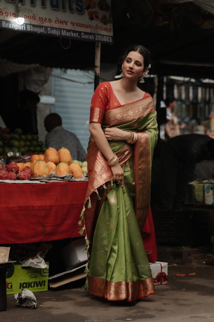 Elegant woman in a colorful saree shopping at a vibrant Indian market